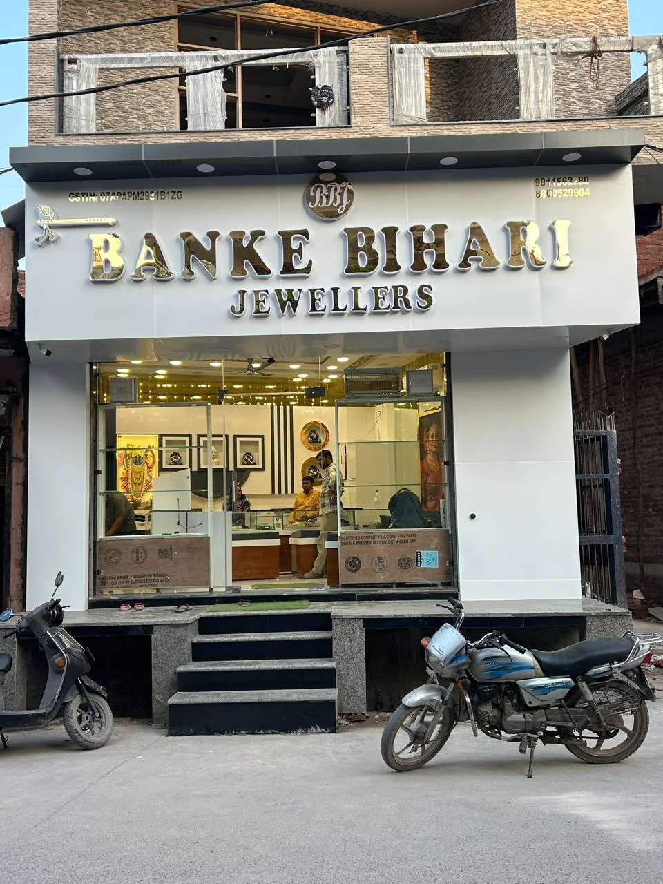 Glazed commercial storefront with an illuminated interior.