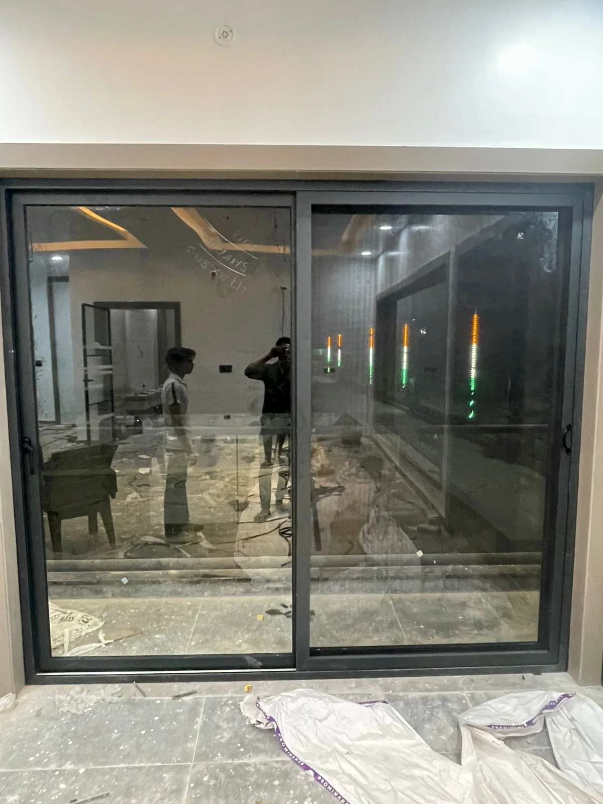 Large black sliding system in finished interior.